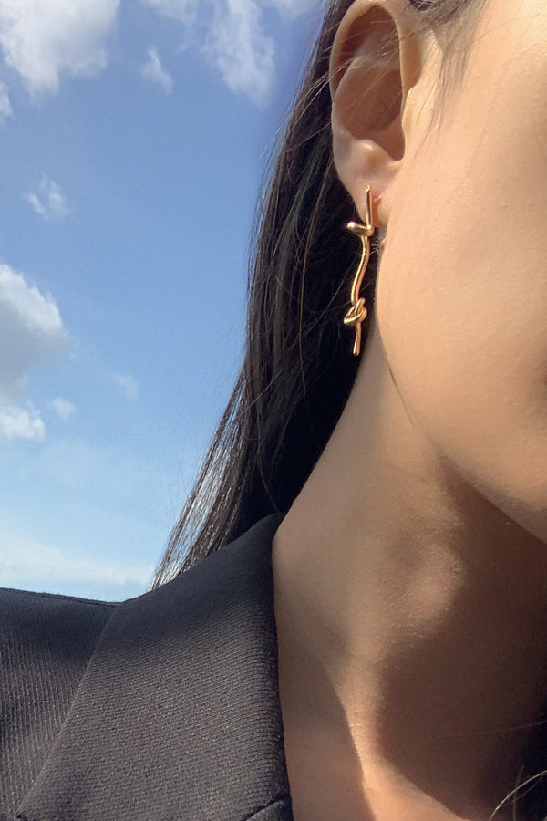 Tinicoterie Gyre Diamond Drop Earring worn by model