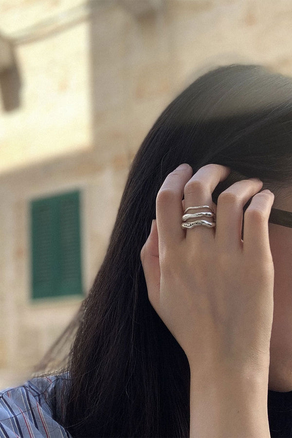Tinicoterie Stream of Consciousness Ring Set (Aella, Bria, Ember Ring) in sterling silver worn on a model