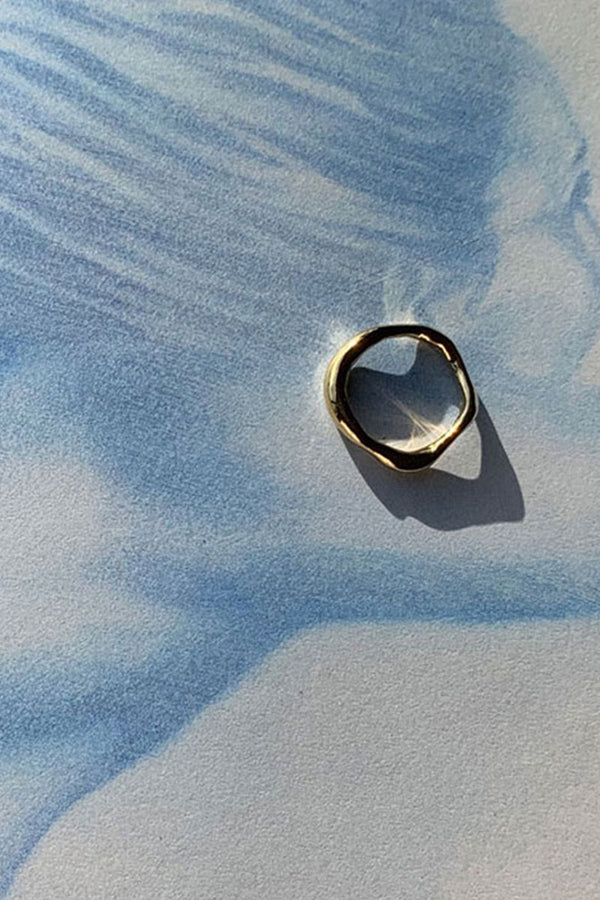 Tinicoterie Bria Ring in gold vermeil on sterling silver styled on textured print