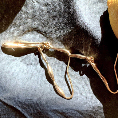 Fluid form gold vermeil silver drop earrings